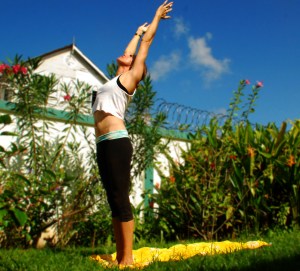 Inhale as you stretch up and gently back, contracting your glutes to protect your low back.